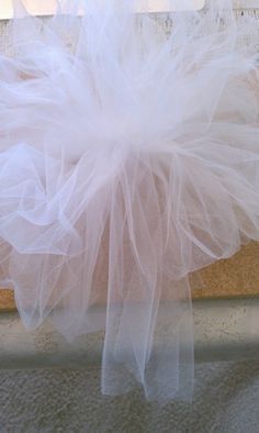 After I saw the price of tulle bows ($7.99 for one bow!), I decided to buy tulle and make them myself. I made two sizes: large bows t... Tule Bows, Tulle Wedding Decorations, Tulle Pompoms, Tulle Garland, Tulle Pew Bows, Girly Crafts, Bow Making Tutorials, Anniversary Crafts, Pew Bows Wedding