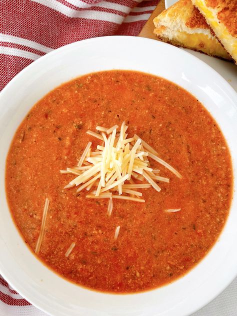 This tomato Parmesan soup is the perfect blend of convenience and deliciousness. With simple ingredients, it's ready in minutes for a cozy meal. Enjoy it on its own or paired with your favorite side dish! Creamy Parmesan Tomato Soup, Tomato Parmesan Soup, Quick Tomato Soup, Easy Tomato Soup Recipe, Tomato Parmesan, Parmesan Soup, Roasted Tomato Soup, Creamy Parmesan, Tomato Soup Recipes