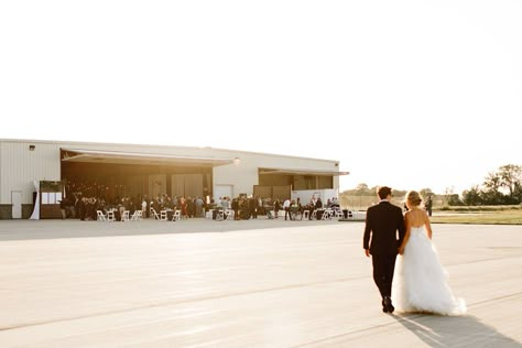 Airplane Hangar Wedding Shows Off Minnesota Style to Out-Of-Town Guests | Minnesota Bride Airplane Hanger Party, Airport Hanger Wedding, Airplane Hanger Wedding, Airplane Hangar Wedding, Aviation Wedding Theme, Airport Theme, Hangar Wedding, Airplane Wedding, Airplane Hanger