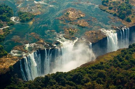 ‪#‎UNESCO‬ World Heritage-listed Mosi-oa-Tunya - Victoria Falls, in Livingston, Zambia: Mosi-oa-Tunya, or ‘the smoke that thunders’, is an awesome experience at any time; the heavy, crashing, awesome cavalcade of the massive Victoria Falls is a powerful sight to behold, with its high, rainbow-inflected plume of spray and the roaring water tumbling with epic force over the 105 metre drop and 1.7 kilometre width. However, if you’re lucky, night time at Vic Falls can be powerfully captivating Zimbabwe Travel, Victoria Falls Zambia, Travelling Places, Waterfall Wallpaper, Zambezi River, Space Girls, Plitvice Lakes National Park, Largest Waterfall, Plitvice Lakes