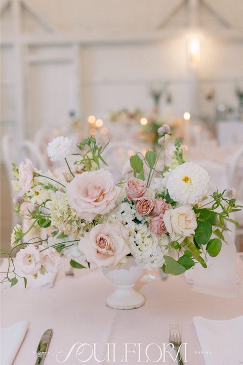 Lush garden inspired centerpieces are more than just a trend- this style is here to stay. These shades of light pink, mauve & green in a white compote are perfect for the reception at The Greenery Milton, NH. Photographer: By Hailie  Planner: Jasmine Rose Events Light Pink Wedding Centerpieces, Light Pink And White Floral Arrangements, Light Pink Flower Arrangements, Light Green And Pink Wedding, Pink And Blue Centerpieces, Pink Flower Centerpieces, Pink Wedding Centerpieces, Pink Flower Arrangements, Monochrome Weddings