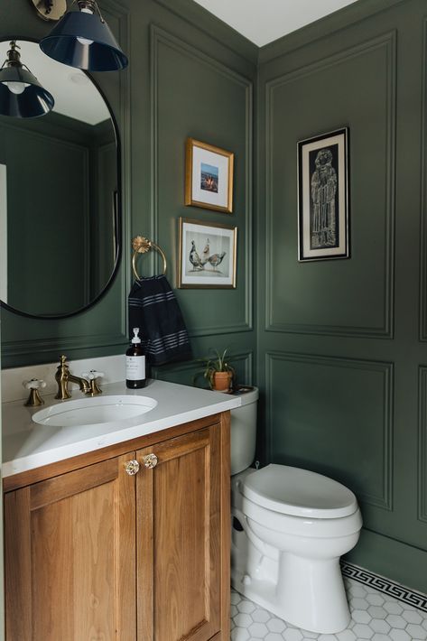 | Curio Design Studio Dark Green Bathroom White Tiles, Hunter Green Accent Wall Bathroom, Studio Mcgee Half Bath, Half Bath Color Drench, Forest Green Powder Room, Small Bathroom Blue Walls, Chairrail Wainscoting Bathroom, Panelling Bathroom Ideas, Dark Green Bathroom Paint