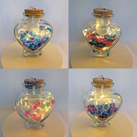 These origami stars are folded by hand from plastic straws. They make lovely gifts, stocking stuffers, night light, or household decoration. Each heart shaped glass jar contains 60 stars of one or two colors of your choosing. Heart Shaped Glass Bottle Ideas, Origami Jar, Oragami Star, Fairy Lights In A Jar, Tiny Home Designs, Plastic Rose, Fairy Led Lights, Jar Of Hearts, Heart Diy