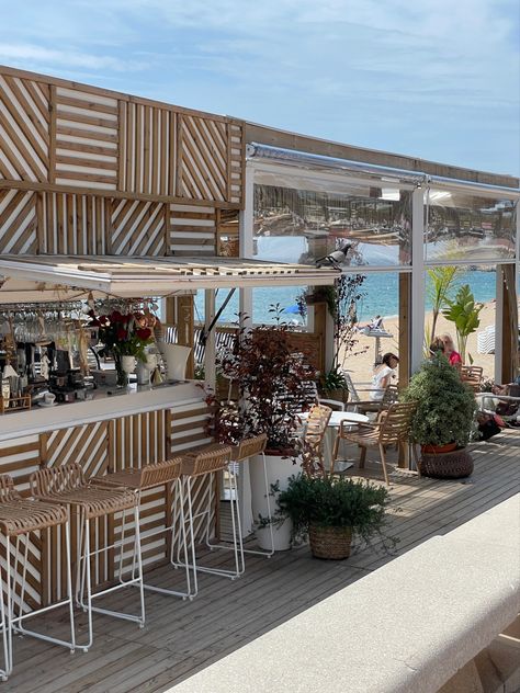 Beach cafe, shoreline, beach, patterns, wood, nature, plants, aesthetic, beige, white, chairs, water, marine, sea Bloxburg Beach Restaurant, Beach Coffee Bar, Coastal Commercial Design, Seaside Cafe Aesthetic, Coffee Shop On The Beach, Beach Shop Aesthetic, Beach Cafe Design, Beach Cafe Aesthetic, Beach Restaurant Aesthetic