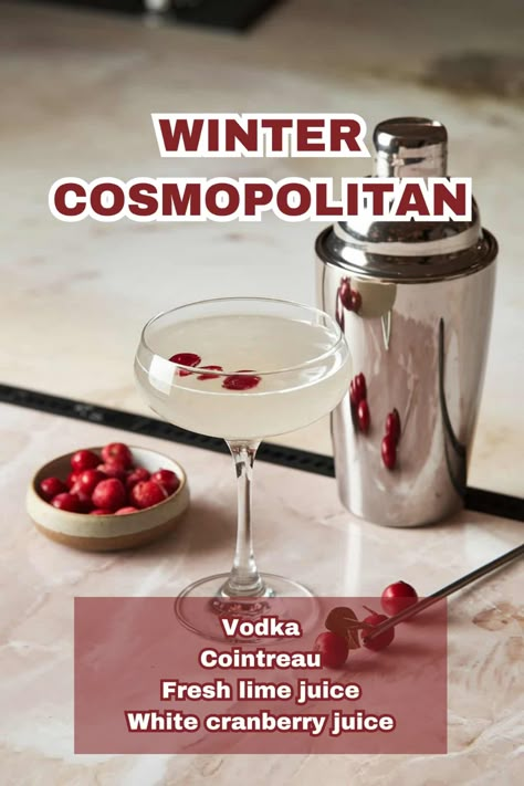 A vibrant Winter Cosmopolitan cocktail garnished with cranberries on a holiday-themed table. Winter Cosmo Recipe, White Winter Cosmopolitan, White Cranberry Cosmo, Winter Cosmopolitan, White Cosmopolitan Recipe, Winter Cosmo, Christmas Cosmopolitan, Cranberry Cosmopolitan, Winter Vodka Cocktails