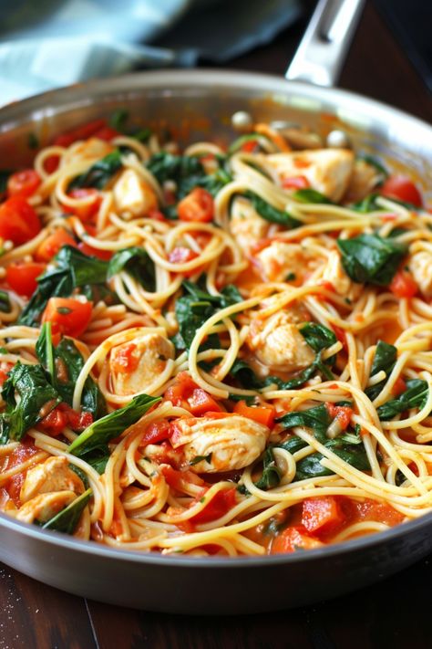 Looking for a delicious and easy dinner idea? Try this Tomato Spinach Chicken Spaghetti recipe. Packed with flavor and nutrients, this dish is perfect for any night of the week. The juicy chicken, fresh spinach, and savory tomato sauce create a mouthwatering combination that your whole family will love. Whip it up in no time and enjoy a satisfying meal that will leave everyone asking for seconds. Add this recipe to your weekly dinner rotation for a tasty twist on traditional spaghetti! Chicken Spinach Roasted Red Pepper Pasta, Tomato Spinach Chicken Spaghetti, Chicken Spinach Spaghetti, Tomato Spinach Chicken Pasta, Spinach Chicken Pasta, Chicken Spinach Recipes, Spaghetti Dishes, Traditional Spaghetti, Chicken Spaghetti Recipe