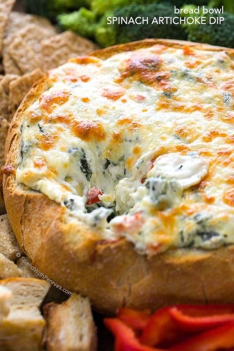 This rich and creamy Hot Spinach and Artichoke Dip recipe is easy, delicious and totally cheesy! Once mixed, this dip is baked until warm and melty in a bread bowl for the perfect football game appetizer. Artichoke Dip In Bread Bowl, Dip In Bread Bowl, Hot Spinach And Artichoke Dip, Warm Spinach Dip, Spinach And Artichoke Dip Recipe, Warm Dip Recipes, Bread Bowl Dip, Best Spinach Artichoke Dip, Hot Spinach Dip