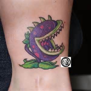 Tattooira Studio Planta Carnívora  Plants Vs Zombies Plants Vs Zombies Tattoo, Zombie Tattoo, Zombie Tattoos, Plant Vs Zombie, Zombie Birthday, Plantas Vs Zombies, Zombie Party, Tattoo Needles, Plants Vs Zombies