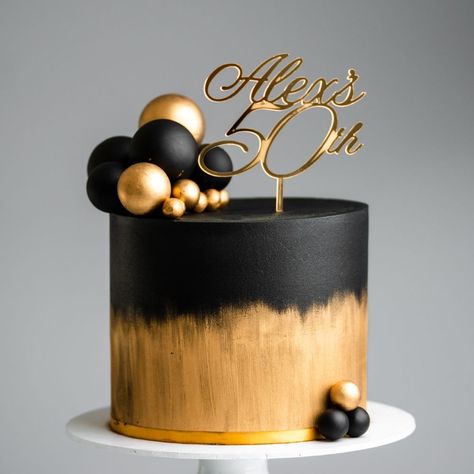 Brushed Gold and Black Sphere Cake Tutorial | buttercream, cake, ganache, icing, chocolate | Our cake decorating courses: https://vimeo.com/rosiesdessertspot/vod_pages And another black and gold cake coming your way! This one features a brushed... | By Rosie's Dessert Spot Black And Gold Engagement Cake, Black Ganache Cake, Black And Gold Tiered Cake, Simple Black And Gold Cake, White Black And Gold Cake, Torte Schwarz Gold, Black And Golden Cake Birthday, Cake Designs Black And Gold, Black And Golden Cake