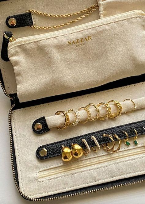 The perfect travel pouch. Keep all your jewelry safe in our Nazzar Jewellery Travel pouch. Slip it in your luggage between your clothes, or just keep it in your hand bag! Fits perfectly! Length: 23cmwidth: 12cmThickness: 2. 5cmMade with: Anti-tarnish lining treated microsuede Vegan leather What fits in the bag? Necklace, rings, eat studs, bracelets, and your hoops Anti-tarnish l...#JewelryLovers #Tidiness #the #Gemstone #Jewelry #Organizers #World #Exploring #The #of #Art #of #JewelryDesign Black Leather Jewelry, Jewellery Organizer, Bag Necklace, Glamorous Jewelry, Travel Jewelry Organizer, Leather Jewellery, Jewelry Organizers, Jewelry Safe, Travel Jewelry Case