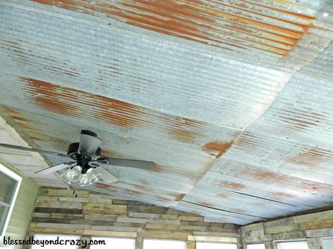 Tin ceiling inside a sun room and pallets on the walls. Very rustic and basically FREE. A great room to entertain or relax in. From blessedbeyondcrazy.com Porch Ceiling Ideas Cheap, Man Cave Ideas Cheap, Tin Ceilings, Barn Tin, Rustic Basement, Porch Ceiling, Man Cave Basement, Sun Porch, Man Room