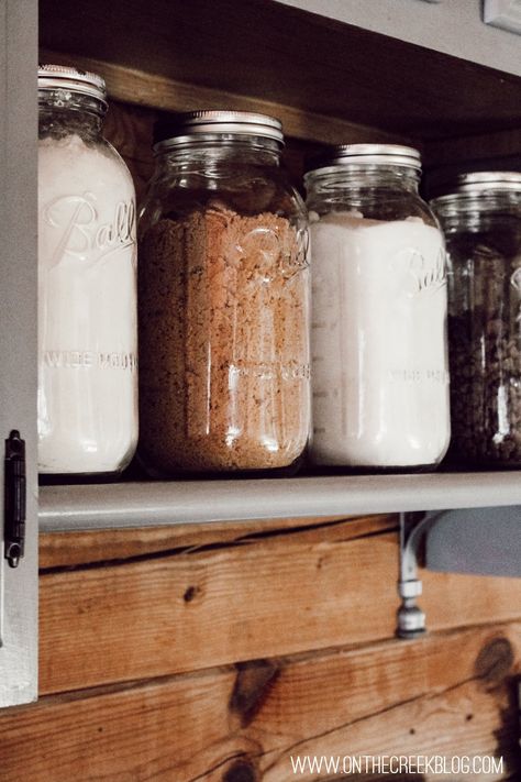 Kitchen baking supplies stored in large mason jars! Cozy Vintage Home, Mason Jar Baking, Baking Supplies Storage, Schoolhouse Lights, Baking Storage, Kitchen Supplies List, Flour Storage, Mason Jar Organization, Baking Supply Store