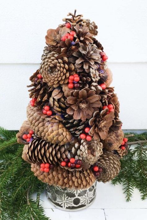 Bring the holiday spirit to small spaces with this delightful pinecone Christmas tree! Decorated with red berries, this tree combines natural elements with festive charm, perfect for apartments or cozy corners. It’s a unique way to celebrate the season without the need for a full-size tree. Get inspired by more small Christmas tree ideas in our blog post and create a holiday look that fits your space beautifully! Small Christmas Tree Ideas, Cozy Cabin Christmas, Pinecone Christmas Tree, Pinecone Christmas, Christmas Tree Decorated, Small Christmas Tree, Twig Tree, Fabric Tree, Small Space Ideas