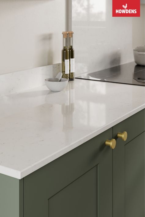 Looking for kitchen worktop ideas or white kitchen countertops? Enhance your traditional kitchen design with the bright tones of our Howdens Bespoke Silestone Miami Vena Marble Quartz Worktop. Pair our quartz worktop kitchen with green kitchen cabinets and brushed brass kitchen hardware. Our marble worktop kitchen is hardwearing and a great option for those looking to introduce a luxurious look for less. Add a matching quartz upstand to finish your contemporary kitchen design. Kitchen Ideas White Worktop, Silestone Quartz Countertops Miami Vena, Miami Vena Quartz Countertops, Quartz Upstand, White Worktop Kitchen, Quartz Worktop Kitchen, White Quartz Worktop, Miami Vena Quartz Kitchen, Silestone Miami Vena Quartz