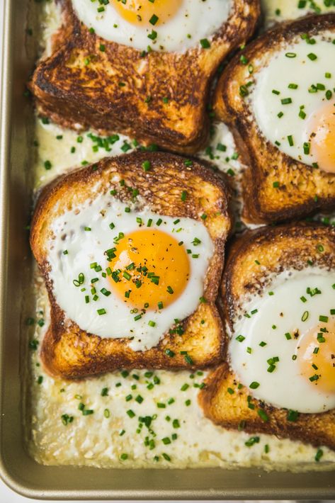 French Baked Toast with Eggs and Cream | Despite the seemingly fancy French name, just think of this as a savory French toast!  Toasted brioche slices are topped with an egg and baked in a puddle of cream that thickens into a béchamel-like sauce for dipping.  Top with fresh chives and a sprinkle of Piment d’Espelette if you dare.  Perfect as a luxurious (yet simple) egg dish for brunch parties and breakfast-for-ones alike!   #food #recipe #eggs #breakfast Baked Toast, French Toast Brioche, Savory French Toast, Brunch Egg Dishes, Egg Baked, Easy French Toast Bake, Frittata Muffins, French Eggs, Savoury French Toast