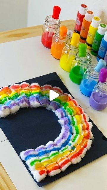 MamaBee👑 on Instagram: "A cute rainbow craft 🌈 

Add some acrylic paint to some water. We used jumbo eyedroppers to drip the paint onto the cotton ball rainbow.

Also, how cute are these tiny little mason jars that I scored at the @dollartree

For more rainbow craft ideas, check out…

@mamasbusybees 
@magicaladventuresandmoreco 
@chels2983 
@threepeasfinds 
@sweetpinklemons 
@sincerely.schwartz 
@beagsandbubs 
@playandread.together 
@luckylittlepennycrafts 
@frassatihomeschooling 
@littlelovebox_ny 
@megjohnsonfamily

Loop hosted by @motherhoodcreatives #motherhoodcreatives

#toddlercrafts #toddlerartsandcrafts #rainbowart #craftsforkids #finemotorskillsactivities #rainbow #stpatricksdaycrafts #artfortoddlers #artoftheday #toddleractivities #activitiesfortoddlers #activitiesforkids #insp Cotton Balls Crafts, Rainbow Activity Preschool, Rainbow Art For Toddlers, Rainbow Painting For Kids, Rainbow Activities Preschool, Cotton Ball Activities, Cotton Ball Painting, Rainbow Craft Ideas, Rainbow Art For Kids