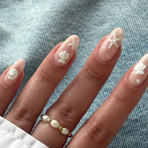 Abi Markey on Instagram: "Save for your next holiday 🐚🦪🤍🫧  Inspired by @nails_by_annabel_m 🫶🏻  @the_gelbottle_inc  Dolly BIAB and Daisy white gel paint Acrylic powder Pearls @amazon @officialnavyprofessional nail prep always ✨  ABI15 discount code 15% off online  @chlobojewellery pearl ring   ———  #pearlnails #navyprep #navybrandcreative #thegelbottle #seashellnails #seashells #holidaynails #biab #pinterestnails #starfishnails #vacaynails #pearlnailart #voguenails #vacayvibes #nailinspo #asosdesign #zarafashion #holidaynailart" White Nails Biab, Nail Designs Pearl White, Holiday Nail Designs Summer, Holiday Biab Nails, Pearl Butterfly Nails, Shell Acrylic Nails, Floral Pearl Nails, White Design Nails, Nails Holiday