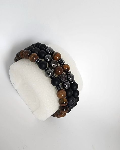 Onyx is known for its protective and grounding benefits while tiger eye beads are believed to bring balance and good fortune. Together, they create a harmonious blend of style and meaning, ideal for the modern man who values both aesthetics and symbolism. # OnyxBeadBracelet #fathersdaygifts #TigerEyeBead #HematiteJewelry #Men'sBracelet #Women'sBracelet #UnisexJewelry #BeadedJewelry #HandmadeBracelet #GiftforHim #GiftforHer #StretchBracelet #HealingStones Grounding Benefits, Hematite Jewelry, Candy Bracelet, Trending Bracelets, Handmade Jewelry Tutorials, Tiger Eye Beads, Eye Beads, Unisex Jewelry, Bracelet Crafts