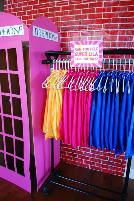 Capes and phone booth at a Girl Superhero Party #girlsuperhero #party Batgirl Party, Supergirl Party, Pink Superhero, Superhero Girls Birthday, Superhero Birthday Party Ideas, Super Hero Birthday Party, Girl Superhero Party, Superhero Party Ideas, Hero Birthday Party