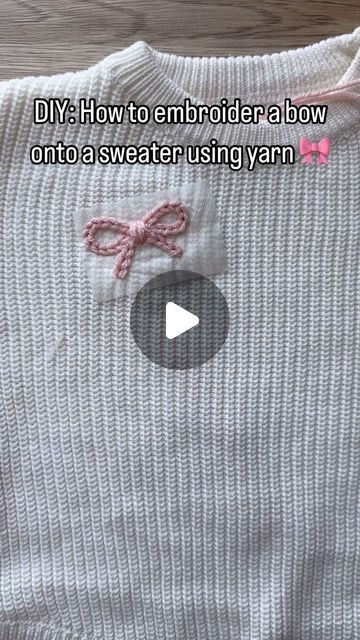 Aspen Lyn Outlet | Hand-Embroidery on Instagram: "How to embroider a bow onto a knit sweater using yarn.  Yarn is a weight 4 from yarn bee!  . . . . #diyembroidery #sulky #embroiderykit #beginnerembroidery #embroiderytutorial #embroidery #handembroidery #yarnembroidery #mamaandme #personalizedbabyclothes #babyshower #babyshowergift #newbornoutfit #announcementoutfit #newbabyannouncement #babynamesweater #customsweater #namesweater #embroideredsweater #coloradomoms #hospitalbag #firstbirthday#coloradosmallbusiness #womanownedbusiness #kidsclothing #embroiderydiy #genderneutral #embroiderytutorial #chainstitch" Knit Embroidery Sweater Name, Yarn Chain Stitch, Simple Sweater Embroidery, Add Embroidery To Clothes, Christmas Sweater Embroidery Pattern, Embroidery Designs On Sweaters, Embroidery With Yarn Letters, Knit Sweater Embroidery Diy, Chunky Yarn Embroidery