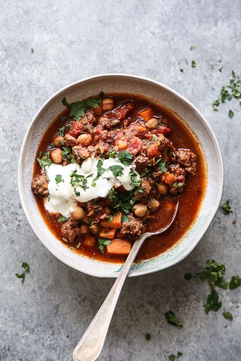 This lamb chili recipe is spiced with Moroccan harissa paste and slow cooked with sweet potatoes, chickpeas, and kale - a great fall gluten-free slow cooker recipe with Mediterranean flavors! | Feed Me Phoebe #FeedMePhoebe #chili #glutenfree #crockpotrecipe #slowcooker #easydinner Lamb Chili Recipe, Lamb Chili, Ground Lamb Recipes, Moroccan Lamb, Moroccan Spices, Sweet Potato Chili, Lamb Dishes, Lamb Stew, Pork Dinner