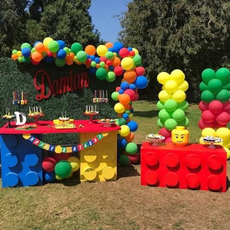 Image may contain: 2 people Lego Setup, Lego Party Decorations, Ninjago Birthday Party, Lego Birthday Cake, Lego Themed Party, Lego Party Ideas, Ninjago Birthday, Lego Theme, Lego Cake