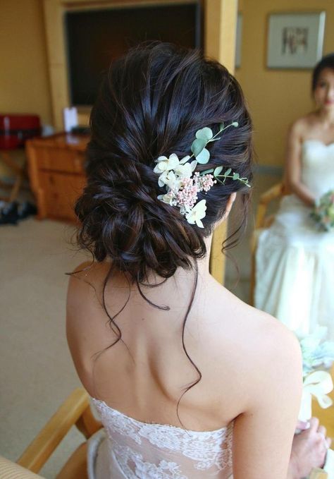 Hairstyles Low Bun Wedding, Flower In Bun Hair, Bridal Updo Brunette Low Buns, Low Messy Bun With Flowers, Low Bun Accessories, Quince Bun Hairstyles With Flowers, Low Bun Hairstyles With Flowers, Low Bun Prom Hairstyles Brown Hair, Side Bun With Flowers