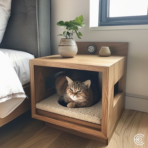 The Cat Scratching Post Bedside Table combines functionality and style. Featuring a built-in scratching post inside the table, it offers a discreet and durable solution for your cat’s scratching needs. The tabletop is perfect for holding a lamp, books, or other essentials, seamlessly fitting into any bedroom decor while keeping your cat entertained and your furniture protected. Conceptual AI Art Follow @ecosapiens for more! Cat Aesthetic Furniture, Cat House Table, Cat End Table, Nightstand Cat Bed, Cat Bedroom Pets, Cats Scratching Furniture, Cat Bedside Table, Catified Bedroom, Cat House Decor