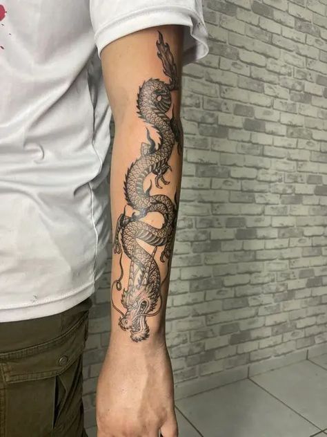 Dragon Tattoos 2024: Bold designs for men 18 ideas Dragon Tattoo Forearm, Dragon Tattoo Stencil, Black Dragon Tattoo, Dragon Tattoo Arm, Hellboy Tattoo, Tattoo Ideas Unique, Tattoo Artist Tattoo, Dragon Tattoos For Men, Unique Tattoos For Men