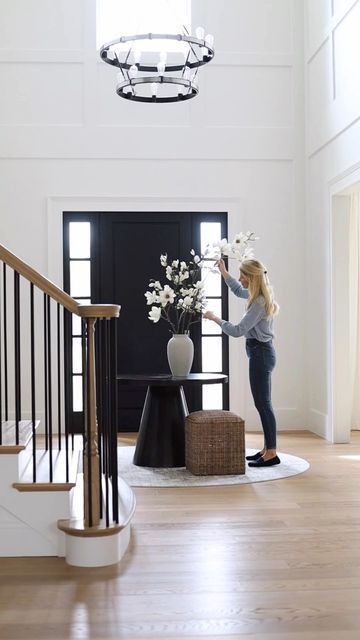 Interior Design | Real Estate on Instagram: "I love a round table in the middle of a foyer … see more of our home on my personal page @katerumson Round table: @sherrillfurniturebrands Faux magnolia branches: @elevengardens #SherrillPartner #newhome #foyerdesign #twostoryfoyer #newbuild #newconstruction #newjersey" Table In Middle Of Entryway, Foyer With Table In Middle, Table In Foyer Entry Ways, Entrance Hall Round Table, Round Table At Entryway, Foyer Center Table, Circle Table Entryway, Round Rug Entryway Front Entry, Foyer Table Round