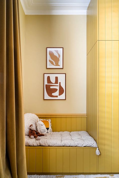 Love everything about this child's bedroom that does double duty as a playroom. Walls: Hay Below the chair rail and closet: India Yellow
Farrow & Ball sample pots available at Hirshfield's Edina and Roseville stores. In-store tinting at our Edina store.

Source: Olivia Lidbury/Domino Photographer: Leo Davut Yellow Kids Bedroom, Yellow Kids Rooms, London Bedroom, Design Hall, Built In Banquette, Bespoke Wardrobe, Victorian Buildings, Yellow Walls, House Bed