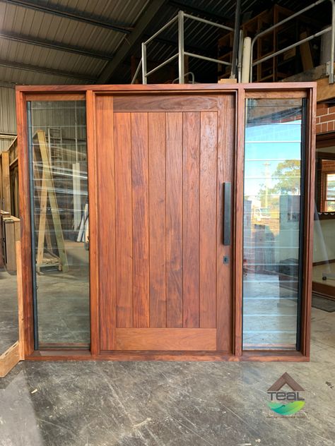 Vertical VJ timber entry door with louvre window sidelights either side. manufactured from Papua New Guinea Rosewood. Black pull handle. Front Door With Louvres, Large Wooden Front Door Entrance, Timber Door Design, Main Door With Window, Doors With Side Windows, Wood Entrance Door, Wooden Entrance Door, Wood And Glass Door, Entrance Wood Door