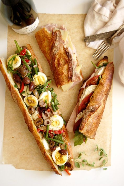 Picnic on the Seine: At Home Edition. Bring a little Paris to your kitchen with these classic French baguette sandwiches, easy to make but substantial enough to be a chic, no-cook dinner. Jambon Beurre is French ham and cheese, and tomato goat cheese makes a juicy, savory option. Pan bagnant is a tuna vegetable sandwich with major wow factor. Lunch gets some "oh la la." . . . . . #fallrecipes #lunch #frenchrecipesauthentic #easyrecipes #fallfooddinner #tunasandwich #ham #cheese #nicoise French Sandwich Baguette, Sandwich With Baguette, Best Baguette Sandwiches, French Lunch Recipes, Baguette Recipe Sandwich, How To Make A Wrap Sandwich, Baguette Sandwich Recipes, French Lunch Ideas, Baguette Recipe Ideas