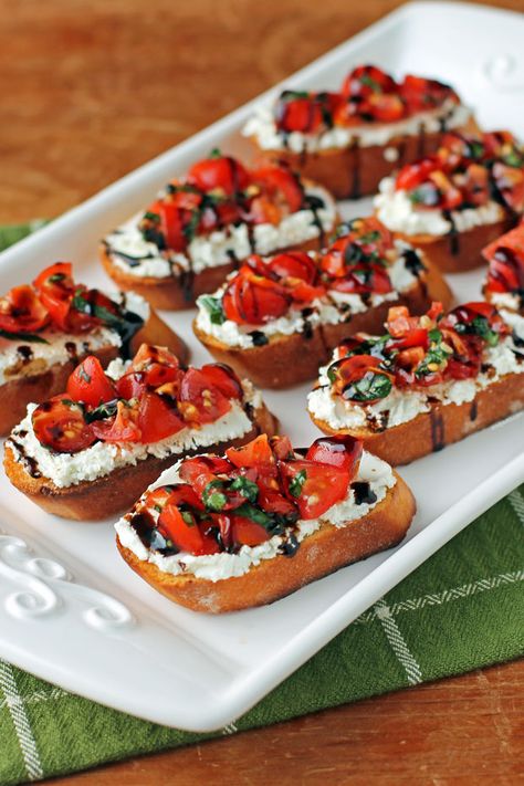 Tomato and Goat Cheese Bruschetta - Emily Bites Birthday Snacks Healthy, Bread With Tomatoes And Cheese, Cheesy Bruschetta Bites, Tiny Bites Appetizers, Small Orderves Party Appetizers, Christmas Bruchetta, Holiday Party Small Bites, Canapes Aesthetic, Cup Food Ideas Parties