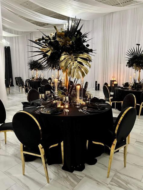 Black And Gold Banquet Ideas, Black Wedding Reception Ideas, Black Gold White And Silver Party Decorations, A Night Of Elegance Party Ideas, Harlem Nights Theme Wedding Reception, Black Silver And Gold 70th Birthday Party Ideas, Masquerade Party Ideas For Adults, Black And Gold Feather Centerpieces, Black And Gold Birthday Party Decor