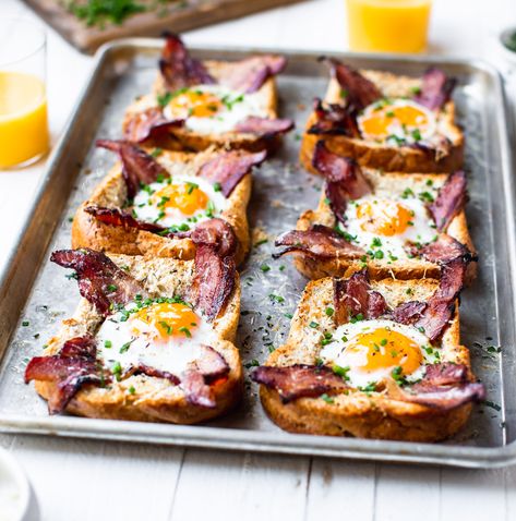 Sheet Pan Egg In A Hole - TableandDish Egg In A Hole Avocado Toast, Egg Hole Toast, Egg In The Basket, Baked Egg In A Hole, Frog In A Hole Breakfast, Egg In Hole Toast, Egg In Toast Hole Oven, Eggs In Toast Hole, Eggs In A Hole Recipe