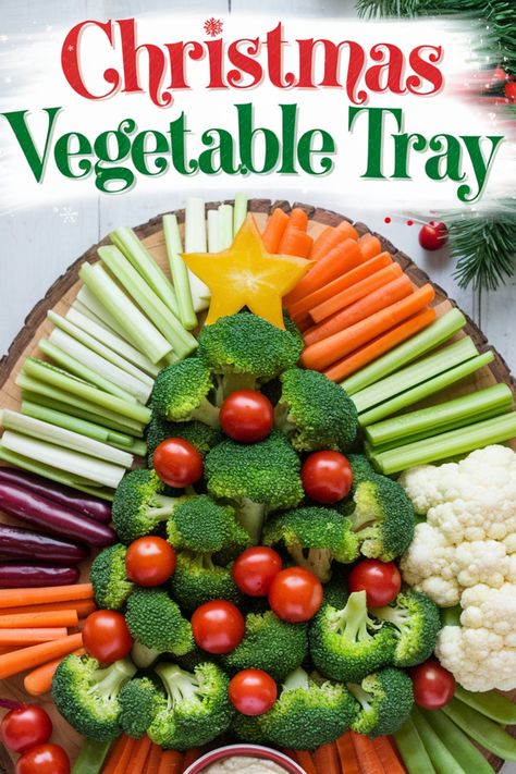 Christmas-themed vegetable tray shaped like a tree, decorated with broccoli, cherry tomatoes, and a star-shaped pepper slice, surrounded by carrots, celery, and cauliflower. Veggie And Meat Tray, Veggie Santa Face, Ideas For Veggie Trays, Decorating With Vegetables, Christmas Appetizers Veggie Tray, Veggie Tray Ideas Parties Vegetable Platters Fun, Christmas Veggie Tray Holiday Parties Vegetable Platters, Christmas Veggie Trays Ideas, Christmas Tree Shaped Veggie Tray