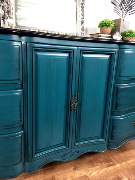 This gorgeous French Provincial dresser was chosen out of our unfinished inventory and customized!  She had a hard time choosing a color for her space.  After much deliberation and color mixing we came across this perfect shade of teal!  We used a combination of Coastal Blue, Emerald, Klein Blue, and Patina Green milk paints along with a splash of Summertime Blue Chalk Style paint to complete it!  We then sealed it with HP Satin and glazed the whole piece with Pitch Black Glaze Effects.  The ... Teal Painted Furniture, Teal Furniture, Provincial Dresser, Patina Green, Painting Antique Furniture, Green Milk, Teal Kitchen, Teal Paint, Painted Furniture Colors