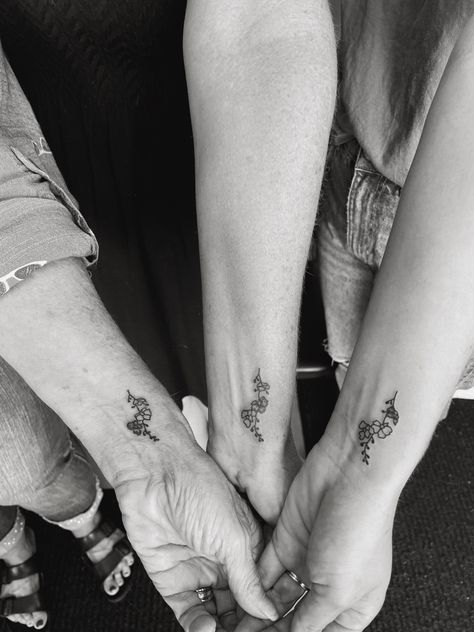 3 generations matching tattoo : daughter, mom, and grandmother Matching Tattoos Mother Daughter Grandma, Matching Tattoos For Mom Daughter And Grandma, Grandma Mother Daughter Tattoos, Grandma Mom And Daughter Tattoo, Generational Tattoos, Matching Grandma Granddaughter Tattoos, Generations Tattoo, 3 Generation Tattoo Ideas, Grandma And Granddaughter Tattoos