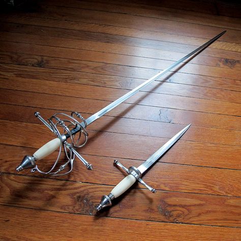 Chance's Rapier and Dagger set Rapier Fantasy Art Swords, Fantasy Rapier Design, Rapier Duelist Aesthetic, Pirate Rapier, Fantasy Rapiers, Rapier Sheath, Fancy Rapier, Rapier Design Dnd, Swords Rapier