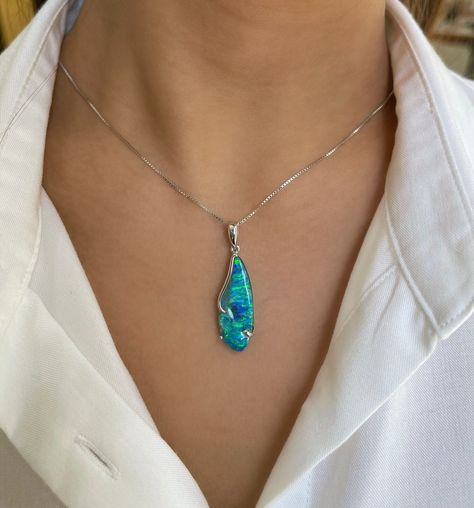 Adorn yourself with the captivating allure of the 'Blue Bay' opal pendant, as charming and expressive as its wearer. This stunning piece showcases a magnificent boulder opal (10.47ct) from Winton, Australia, boasting a mesmerizing play of bright blue-green colors.⁠ ⁠ This pendant captures the essence of the tranquil Australian sea, bringing joy and calmness to its wearer.⁠ ⁠ ⁠ #BlueBayOpal #LimitedEditionLuxury #AnniversaryGifts #ExquisiteElegance #opalminded #jewellerydesigner #jewelrydesign... Boulder Opal Jewelry, Opal Choker, Blue Bay, Opal Earrings, Australian Opal, Opal Pendants, Boulder Opal, Opal Jewelry, Fine Jewellery