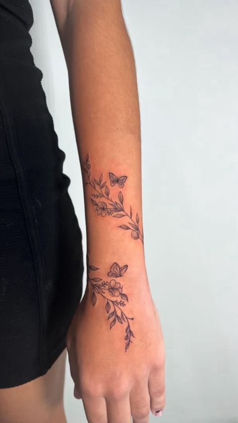 Vine Tattoos On Wrist, Womens Wrap Tattoo, Sleeve Tattoo Starter Ideas, Shoulder Tattoo Female Upper, Forearm Tattoos Floral, Tattoos For Outer Forearm, Butterfly Tattoo With Flowers And Date, All Around Arm Tattoo, Vine Wrist Wrap Tattoos For Women