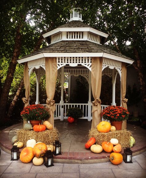 Fall decor for a outdoor wedding ceremony. Hay, lanterns, mums, & gourds. Fall Wedding Gazebo Decor, Fall Wedding Pavilion Decorations, Gazebo Wedding Decorations Rustic, Gazebo Fall Decor, Wedding Gazebo Decorations Outdoor Fall, Fall Gazebo Decorations, Fall Wedding Lanterns, Fall Wedding Elopement Ideas, Fall Gazebo Wedding