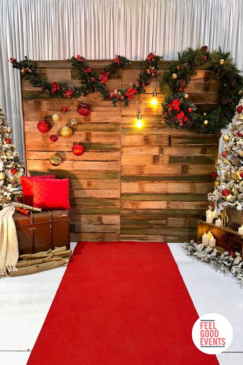 Rustic backdrop surrounded by christmas trees, pine garlands, wreath, ornaments and candles Christmas Stage Decorations, Rustic Christmas Party, Diy Christmas Backdrop, Diy Christmas Photo, Christmas Photo Booth Backdrop, Christmas Party Backdrop, Christmas Booth, Church Christmas Decorations, Photo Backdrop Christmas