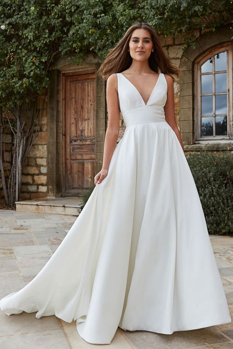 Backless minimalist taffeta ballgown with a defined waist, pockets. Cold Shoulder Wedding Dress, Jenny Yoo Bridal, Asymmetrical Wedding Dress, Wedding Dresses Near Me, Wedding Dress Silhouette, Navy Blue Bridesmaid Dresses, 2025 Wedding, Affordable Wedding Dresses, Jenny Yoo