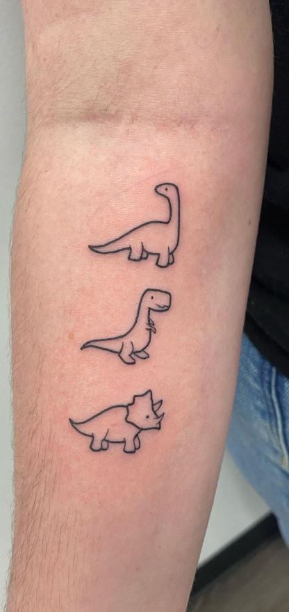 125 Dinosaur Tattoo Designs for the Dino Devotee - Tattoo Me Now Small Dino Tattoos Matching, Simple Tattoos Dinosaur, Three Dinosaur Tattoo, Dinosaur Tiny Tattoo, Family Dinosaur Tattoo, Simple Trex Dinosaur Tattoo, Dino Flash Tattoo, Dinosaur Simple Tattoo, Tiny Triceratops Tattoo