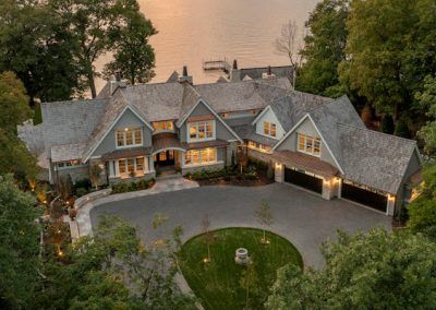 Exterior Black Windows, Coastal Mansion, Stone Porch, Hamptons Houses, Porch With Fireplace, 4 Car Garage, Lake Houses Exterior, Neutral Earth Tones, Contemporary French