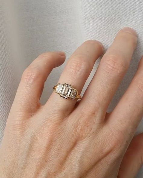 Natalie Marie Jewellery on Instagram: "Inspired by one our most-loved one of a kind designs, the Greta Trio Ring.
⁠
Featuring three emerald cut diamonds, bezel set with a half-round band.⁠
⁠
Let your imagination to take the lead, craft your dream piece with our bespoke team today, link in bio." Natalie Marie Jewellery, Half Bezel Setting, Natalie Marie, Half Bezel, Trio Ring, Future Engagement Rings, Pave Band, Jewelry Lookbook, Emerald Cut Diamonds