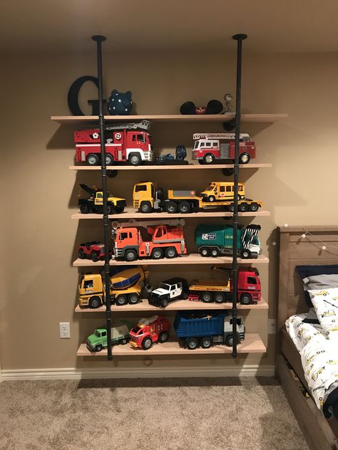 Truck storage bruder trucks shelves toy storage boy room boys Boy Toy Storage, Toy Organization Diy, Diy Toy Storage, Big Boy Bedrooms, Toddler Boys Room, Playroom Organization, Toddler Rooms, Toddler Bedrooms, Toy Rooms