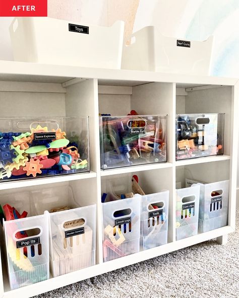 white cubby storage shelves, storage bins with labels, storage bins on top of shelves, rainbow mural, carpet Toy Room Closet Organization, Cubby Organization Ideas, Organizing Toddler Toys, Playroom Organization Small Space, Toy Room Organization On A Budget, The Home Edit Playroom, Classroom Toy Storage, Toy Organization For Small Spaces, Playroom Closet Organization